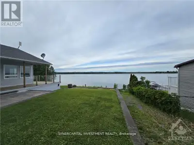 Beautiful Waterfront Property with Panoramic Views , Private Launch and Garage for Fishing Boat or T...
