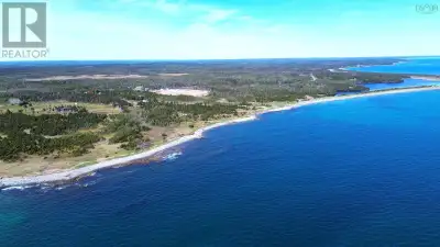Waterfront Property Just Minutes from Popular Point Michaud Beach Set on over 7 acres, with an addit...