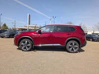 This pre-owned 2023 Nissan Rogue Platinum is finished in a beautiful Red paint with a refined Graphi... (image 2)
