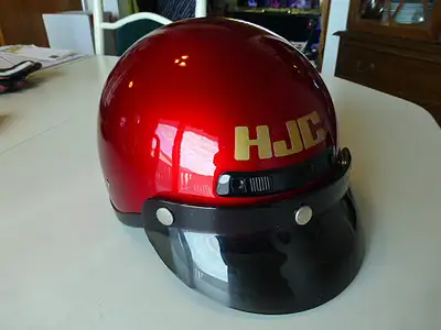 HJC FG-2 motorcycle helmet in candy red. Comes with zip out ears/neck wind blocker for cooler weathe...