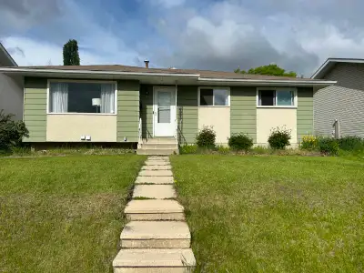 Never judge a book by its cover... or a bungalow by its colour! This charming home backs onto the be...
