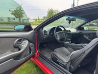 La Pontiac Firebird Trans Am 1994 est lun des modèles les plus emblématiques de lère des voitures sp... (image 6)