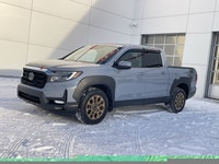 Our 2023 Honda Ridgeline Touring in Sonic Grey with the Honda Performance Development Package is in... (image 2)