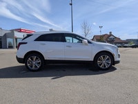 The pre-owned 2024 Cadillac XT5 Premium Luxury AWD in Mary Kay Pearl with a Jet Black interior deliv... (image 7)