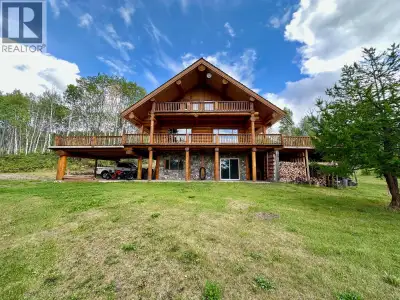 Custom Log Home on 5 Acres with Stunning Views in Telkwa, BC. Perched above Tyhee Lake with incredib...
