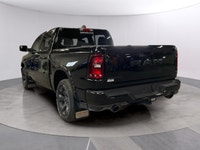The 2026 Ram 1500 Big Horn 4x4 Crew Cab in a striking black exterior combines rugged durability with... (image 2)