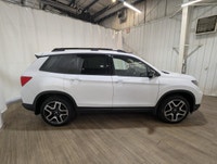 Experience the perfect blend of elegance and performance with the 2023 Honda Passport Touring AWD, d... (image 7)