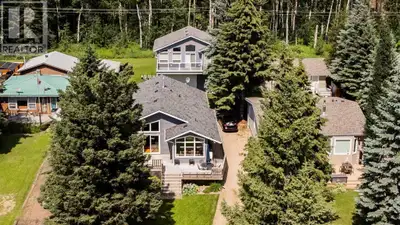 This Beautiful lake property hosts a 1407 sq/ft home and a Garage with a fully finished loft above....