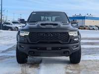 The 2026 Ram 1500 RHO Crew Cab in Diamond Black Crystal Pearl delivers bold styling and high-perform... (image 9)