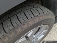 Embrace the thrill of the open road with this 2024 Kia Seltos EX, a vibrant green SUV boasting a rem... (image 9)