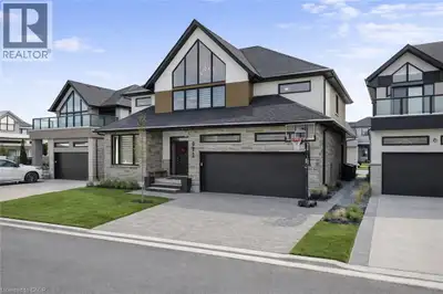 Welcome to 972 Stonecliffe Walk - an exceptional Ridgeview Homes - built detached home nestled in on...