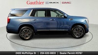 The 2025 GMC Yukon Elevation combines bold styling, spacious versatility and powerful performance in... (image 1)