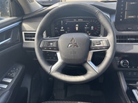Introducing the 2026 Mitsubishi Outlander Plug-In Hybrid SE S-AWC, gliding in with a captivating sil... (image 7)