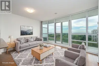 Welcome to Beyond the Sea Condominiums and this sun-filled one bedroom plus den condo suite with uno...