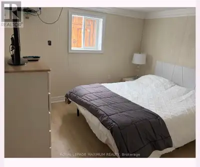 Bright and Spacious Lower-Level Apartment Featuring a Private Entrance and Modern Updates Throughout...
