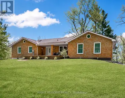 Spacious country bungalow on 4.86 acres, minutes to Hwy 401. Set back from the road for peace and pr...