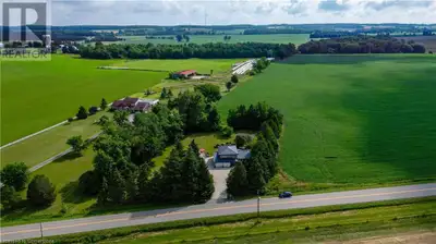 Escape to the country—just 20 minutes from Kitchener-Waterloo! Sitting on a beautifully treed 1.1-ac...