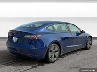 The 2021 Tesla Model 3 offers LED auto-leveling headlights, a panoramic sunroof, and aluminum wheels... (image 4)