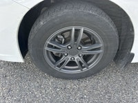 The 2014 Honda Civic Sedan LX, in a pristine white finish and equipped with a smooth front-wheel-dri... (image 9)