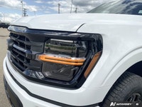 The 2026 Ford F-150 XLT, dressed in a striking Oxford White finish, showcases a commanding 4x4 drive... (image 8)