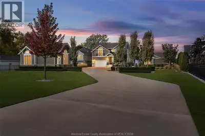 11770 Riverside Dr Arrive home to a private waterfront sanctuary where timeless Hamptons elegance me...