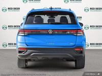 Introducing the 2025 Volkswagen Taos Comfortline Black Edition, a striking blue AWD SUV with an impe... (image 4)