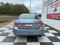 A reliable midsize sedan with a comfortable interior, smooth performance, and practical convenience... (image 4)
