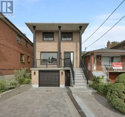 Beautifully renovated 4+1 bedroom, 4-bathroom detached home in East York, featuring a private drivew...
