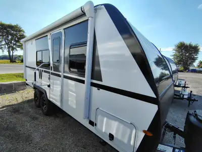 The 2026 Winnebago Micro Minnie 2108TB is a compact travel trailer featuring a front twin-bed setup...