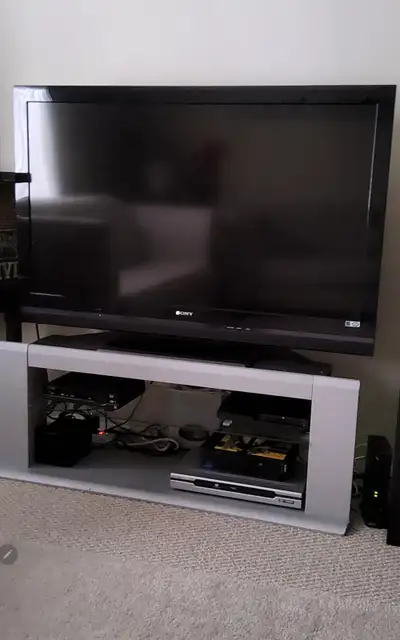 TV stand with glass shelves for $35.00, L 50"× H 18.5, View more