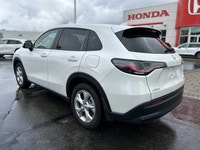 The pristine Platinum White Pearl exterior of this 2024 Honda HR-V LX-B instantly captivates. With j... (image 6)
