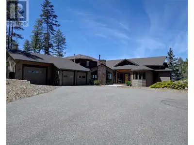Welcome to your dream home overlooking breathtaking Okanagan Lake! Experience ultimate privacy & pan...