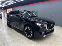 The 2024 Mazda CX-90 PHEV GT in a stunning black finish offers the perfect blend of luxurious style... (image 5)