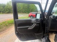 A rugged four-door SUV with iconic styling, manual transmission, and strong 4x4 capability, offering... (image 6)