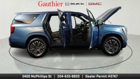 The 2025 GMC Yukon Elevation combines bold styling, spacious versatility and powerful performance in... (image 7)