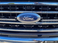 Experience the power and capability of the 2021 Ford F-150 XLT, now available in a striking blue fin... (image 7)