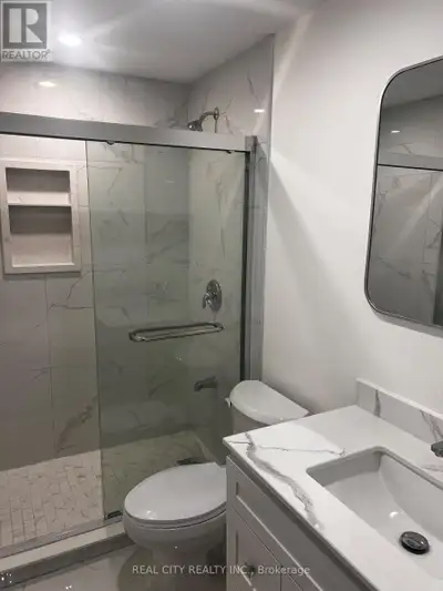 Welcome to this bright, modern lower-level 1-bedroom, 1-bathroom professionally finished basement. T...