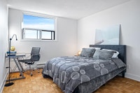 Fully renovated spacious suite features kitchen with modern features and finishes including laminate... (image 6)