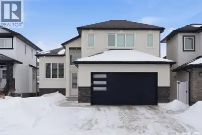 Welcome Home to 406 Hamm Lane in Rosewood, Saskatoon Step into something truly special. Nestled in o...