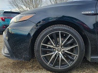 Experience the refined elegance of the 2021 Toyota Camry in its sophisticated black finish and effic... (image 4)