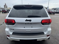 Our exclusive 2021 Jeep Grand Cherokee Limited 4X4 wraps assertive capability in a dramatic Bright W... (image 3)