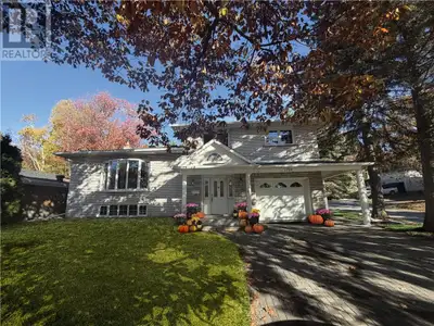 Welcome to this charming four-level side split, lovingly owned by the same family for over half a ce...