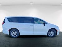 The 2024 Chrysler Pacifica Touring-L FWD, dressed in a pristine white finish, offers a smooth and co... (image 4)