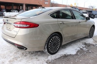 Capital Ford Lincoln Winnipeg Ltd (MB's #1 Rated Ford Store) This WHITE GOLD AWD Fusion Titanium res... (image 3)