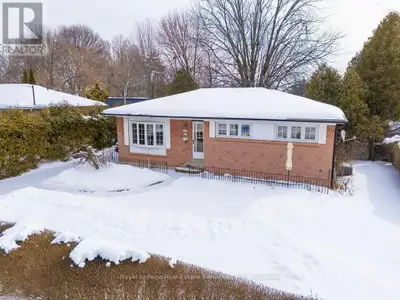 This solid family home is located on a quiet street, set on a mature, tree-lined lot (67 x 125 x 65...