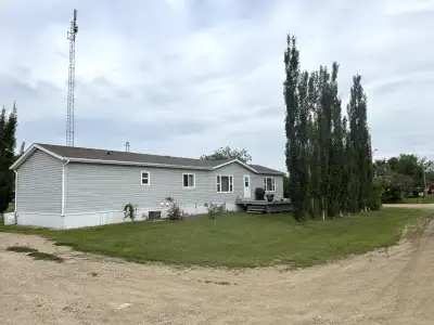 Located in a quiet community just moments from the scenic shores of Lake Diefenbaker, this well-cons...