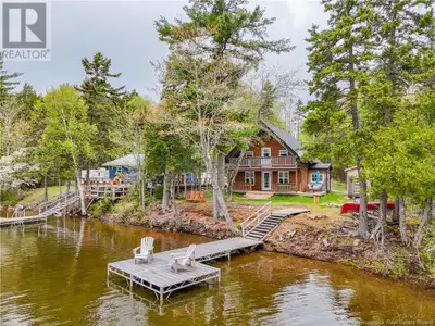 WATERFRONT DREAM HOME! Welcome to 205 Carlin Lane, a stunning waterfront dream home designed for com...