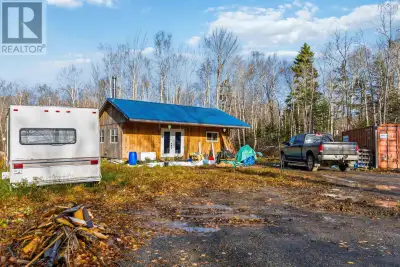 Located on a sizable lot set back from Purdy Road, this 4.08-acre off-grid property offers the freed...