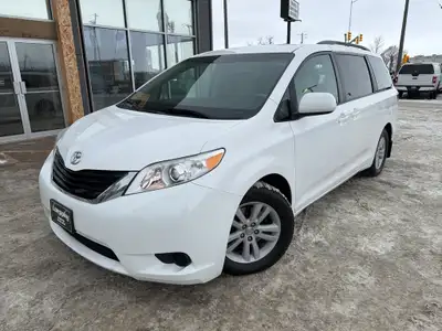 This 2014 Toyota Sienna LE in classic white is a proven, family-friendly minivan known for outstandi...