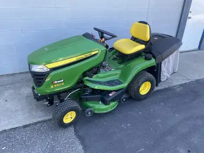 John Deere X350R Riding Lawn Mower. 21.5HP with rear bagger and dump from seat. 42in. Mower Deck. Li...